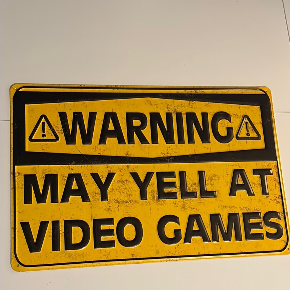 May yelll at video games sign